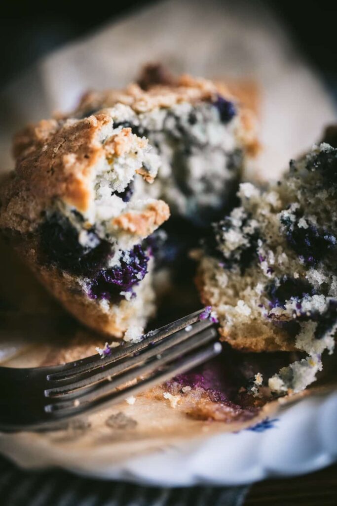 Closeup of blueberries in a muffin.