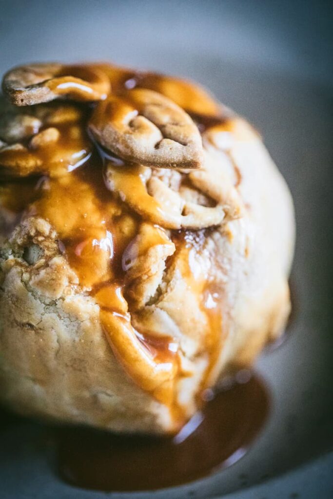 pastry covered apple with caramel sauce