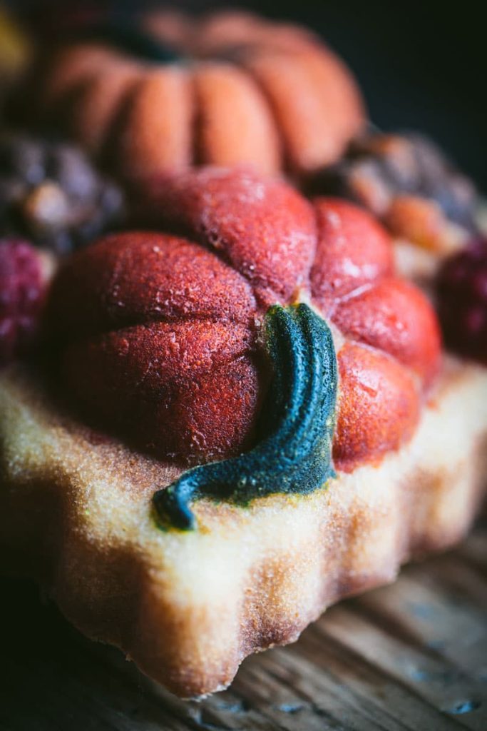 orange pumpkin on top of cake loaf