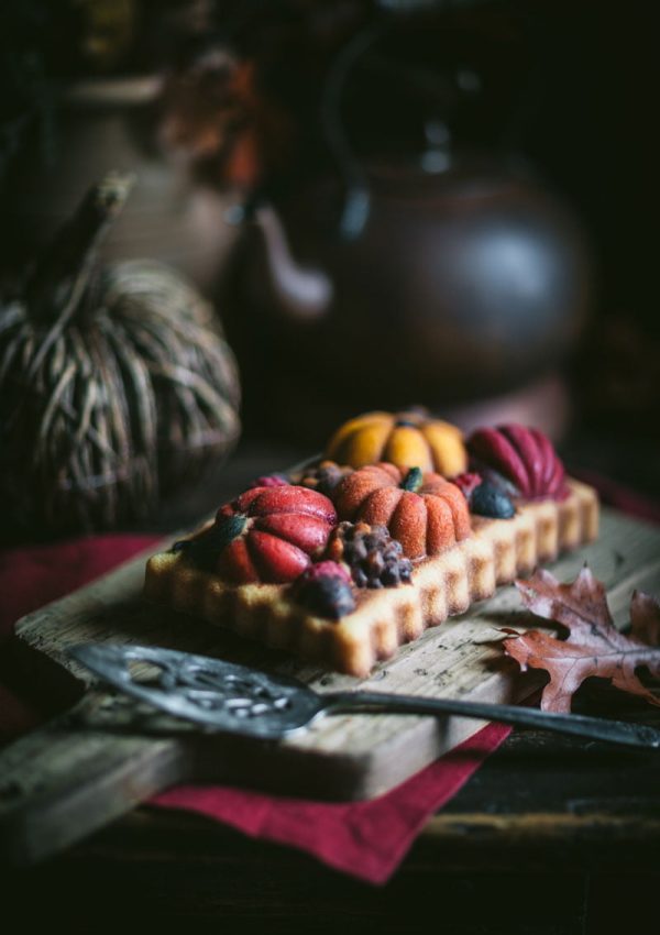 colorful loaf cake with pumpkins on a table