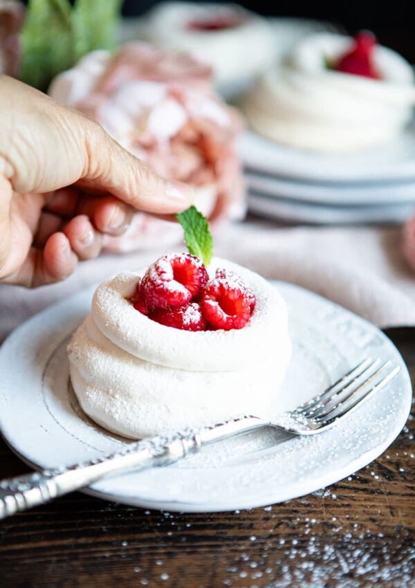 Mint leaf placed on meringue tart