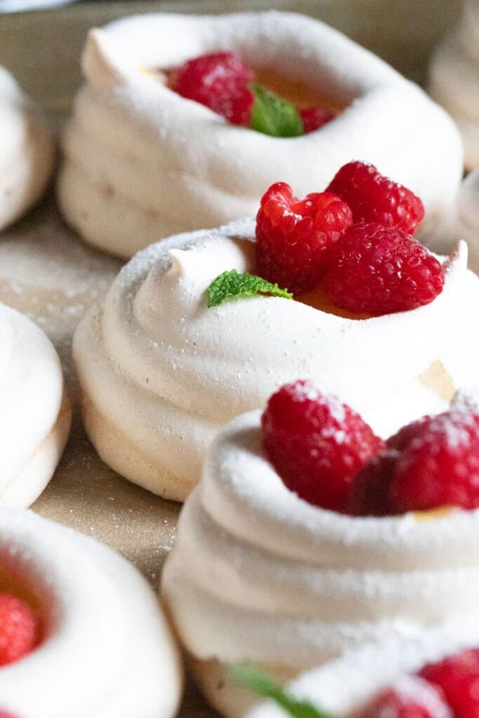 meringue nests filled with raspberries