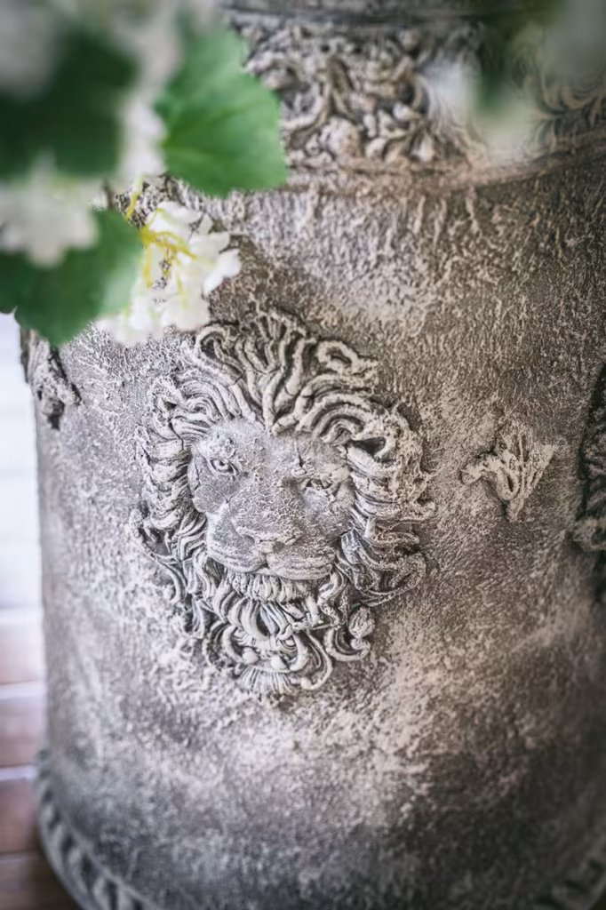 lion face on vase